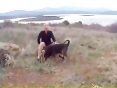 Woman in the forest fucks her dog